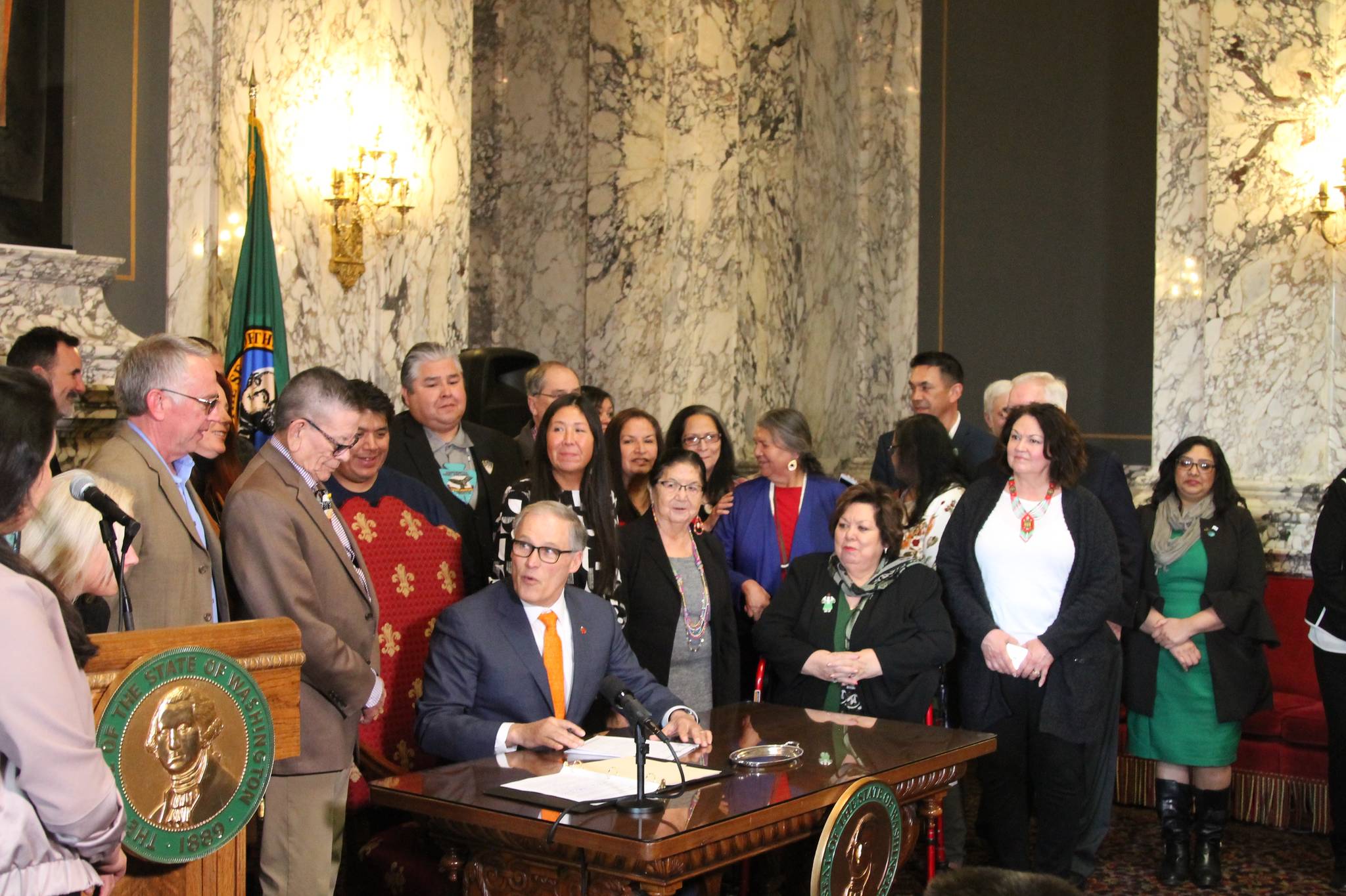 Gov. Jay Inslee signs into law the second bill to be passed by the Legislature this session. The Native American Voting Rights Act allows the use of non-traditional address to be used for voter registration for residents who live on Indian reservations. – Photo by Emma Epperly, WNPA Olympia News Bureau