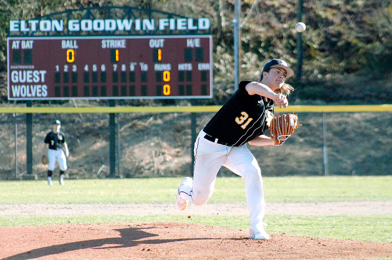 P.J. Moritz pitches in the shadow of the scoreboard at Elton Goodwin Field. (Mark Krulish/Kitsap News Group)