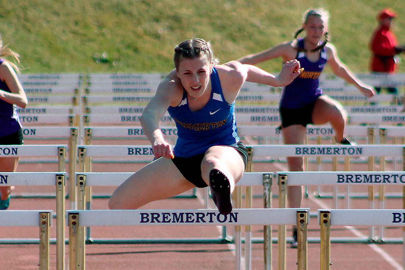 State champion hurdler Lauryn Chandler leaps to victory in the 100-meter hurdles. (Mark Krulish/Kitsap News Group)