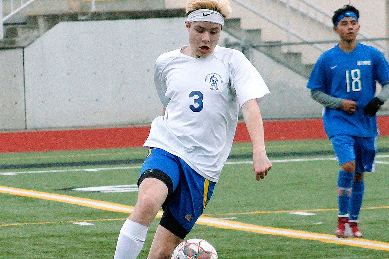 Bremerton’s Carter Braunz get the ball and looks to turn up field against Olympic. (Mark Krulish/Kitsap News Group)