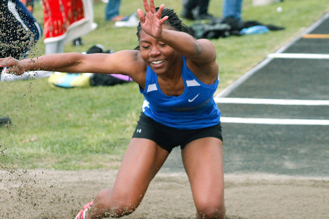 Bremerton’s Te’Caela Wilcher sticks the landing during the long jump competition. (Mark Krulish/Kitsap News Group)