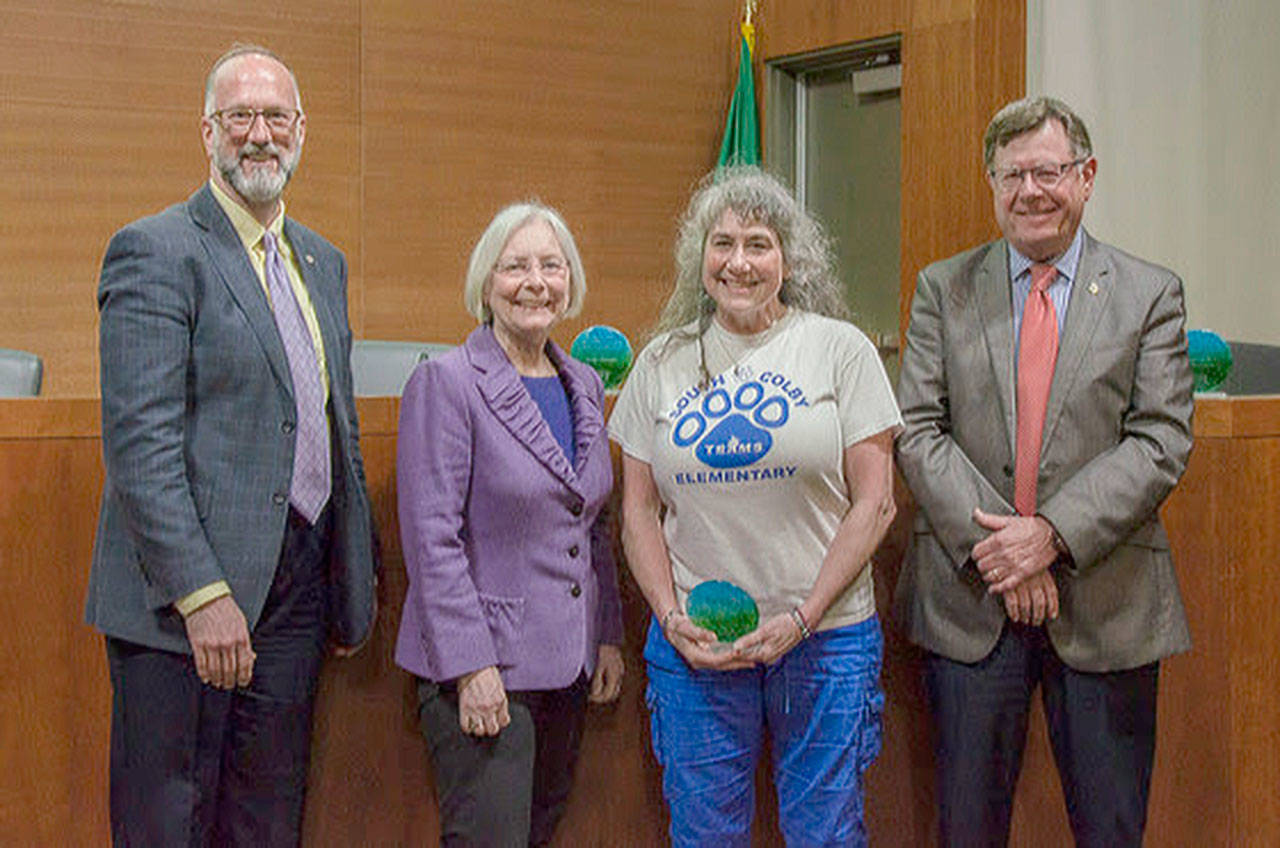 Waste reduction and recycling advocate Donna Hollon (second from right) was nominated as a 2019 Earth Day Award winner. Left to right: Kitsap County commissioners Rob Gelder and Charlotte Garrido, Hollon and Commissioner Ed Wolfe. (Kitsap County photo)