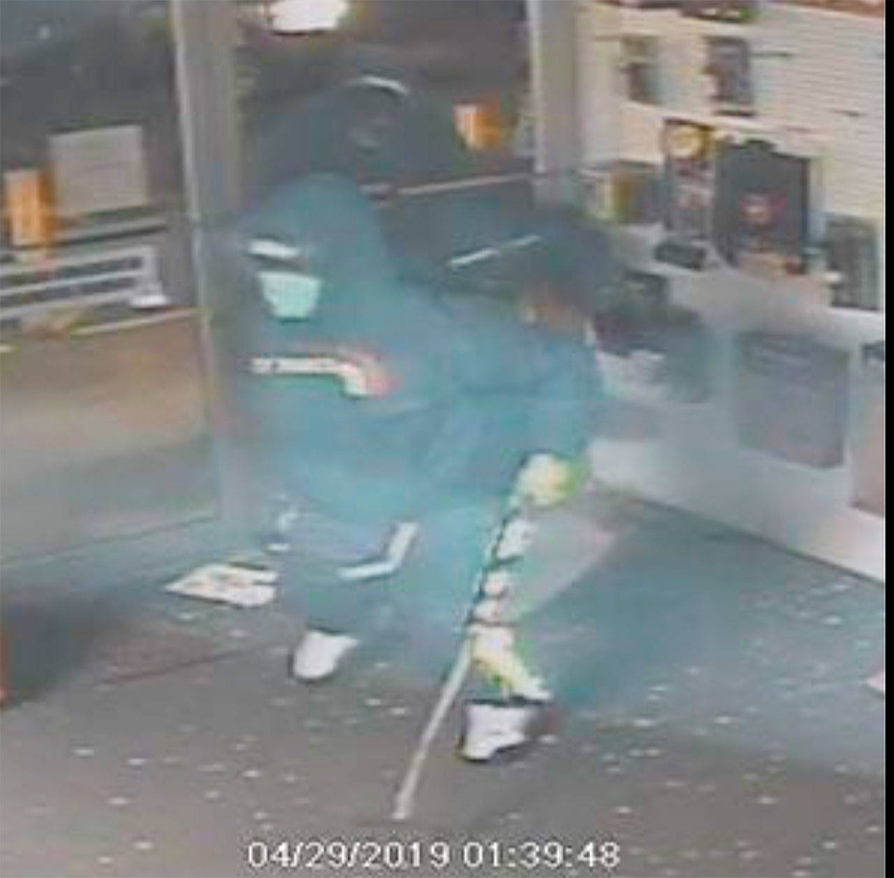 One of the suspects recorded breaking into Boerner Firearms in Gorst was described as being a large-statured individual wearing a sweatshirt with a CDXX logo on the front. (Kitsap County Sheriff’s Office photo)