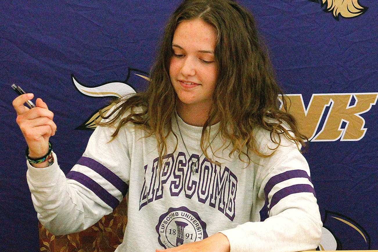 Raelee Moore signed to Lipscomb University in front of family and friends. (Mark Krulish/Kitsap News Group)
