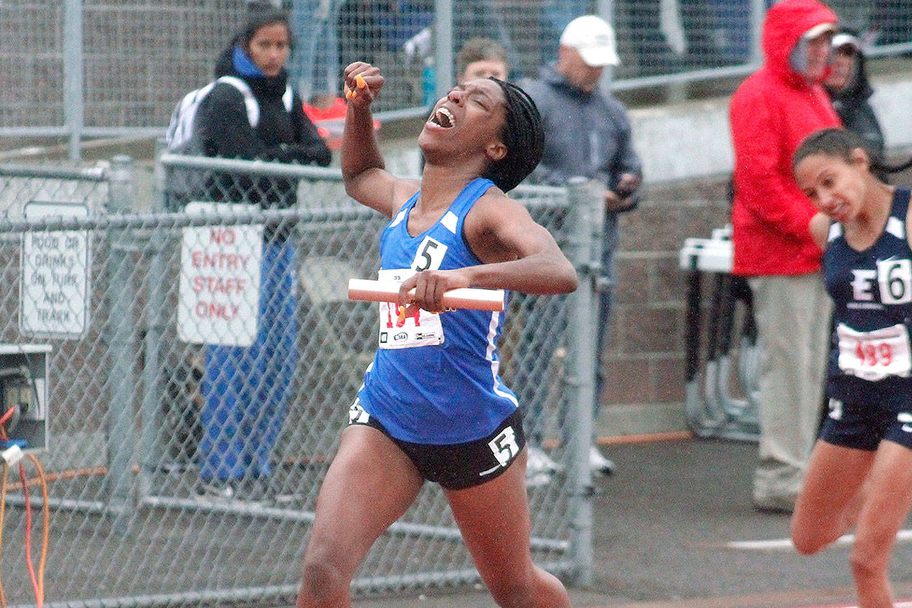 Tyishea McWhorter crosses the finish line in first place after running anchor on Bremerton’s state championship 4x100 relay team. (Mark Krulish/Kitsap News Group)