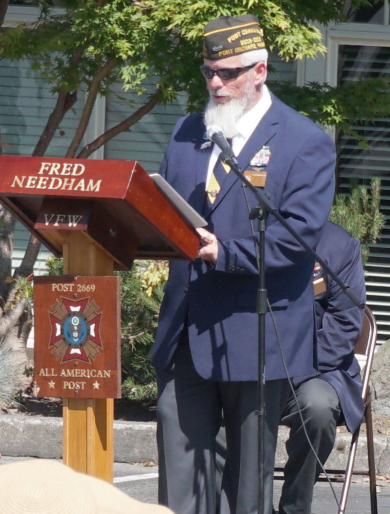 VFW Post 2669 Commander Dan Bujok delivers welcoming remarks to veterans and community members at the Manchester Veterans Memorial Observance at the Manchester Community Library on Memorial Day. (Bob Smith | Kitsap Daily News)