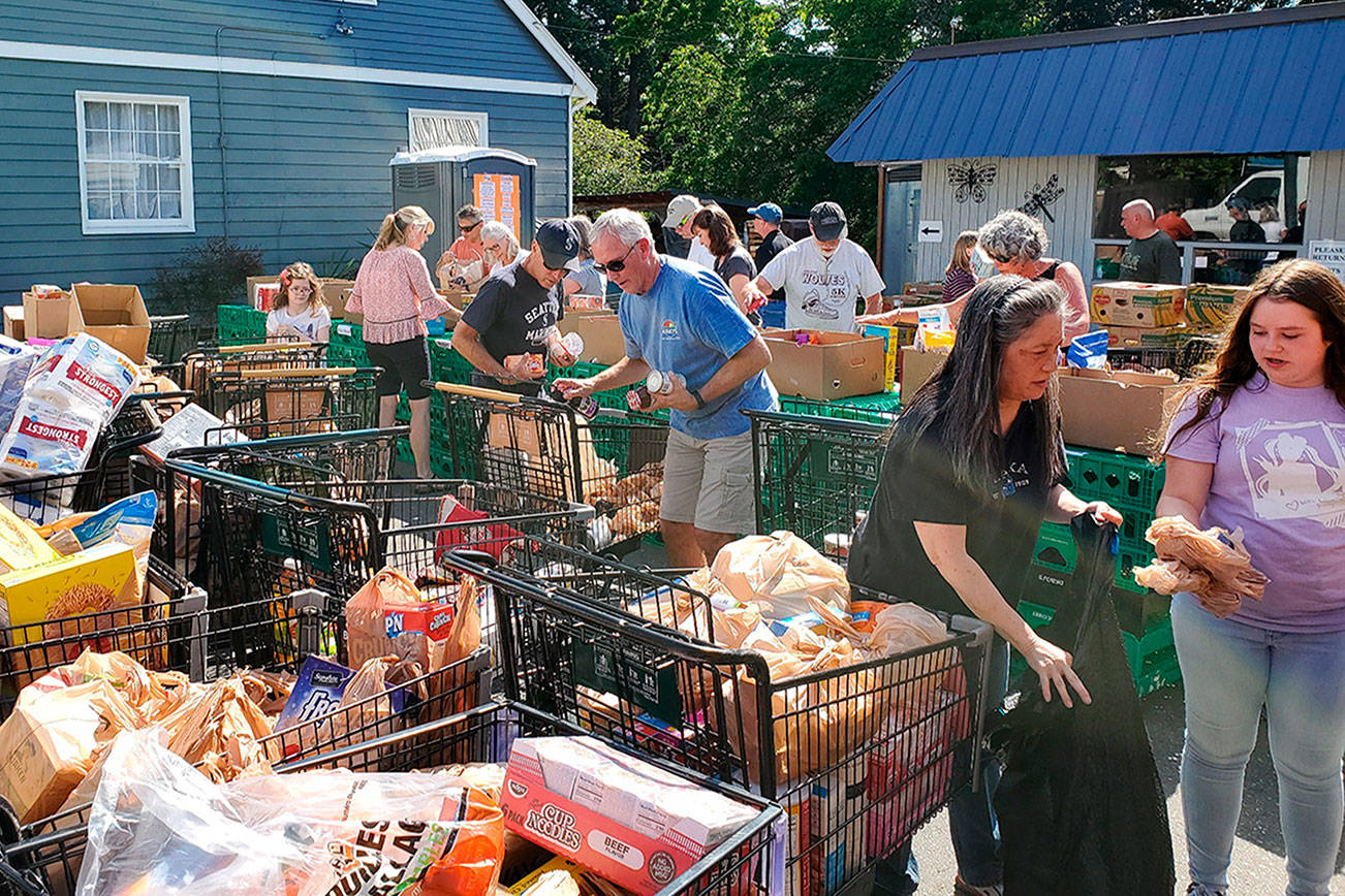 ‘Stuff the Bus’ volunteers gather food for Helpline