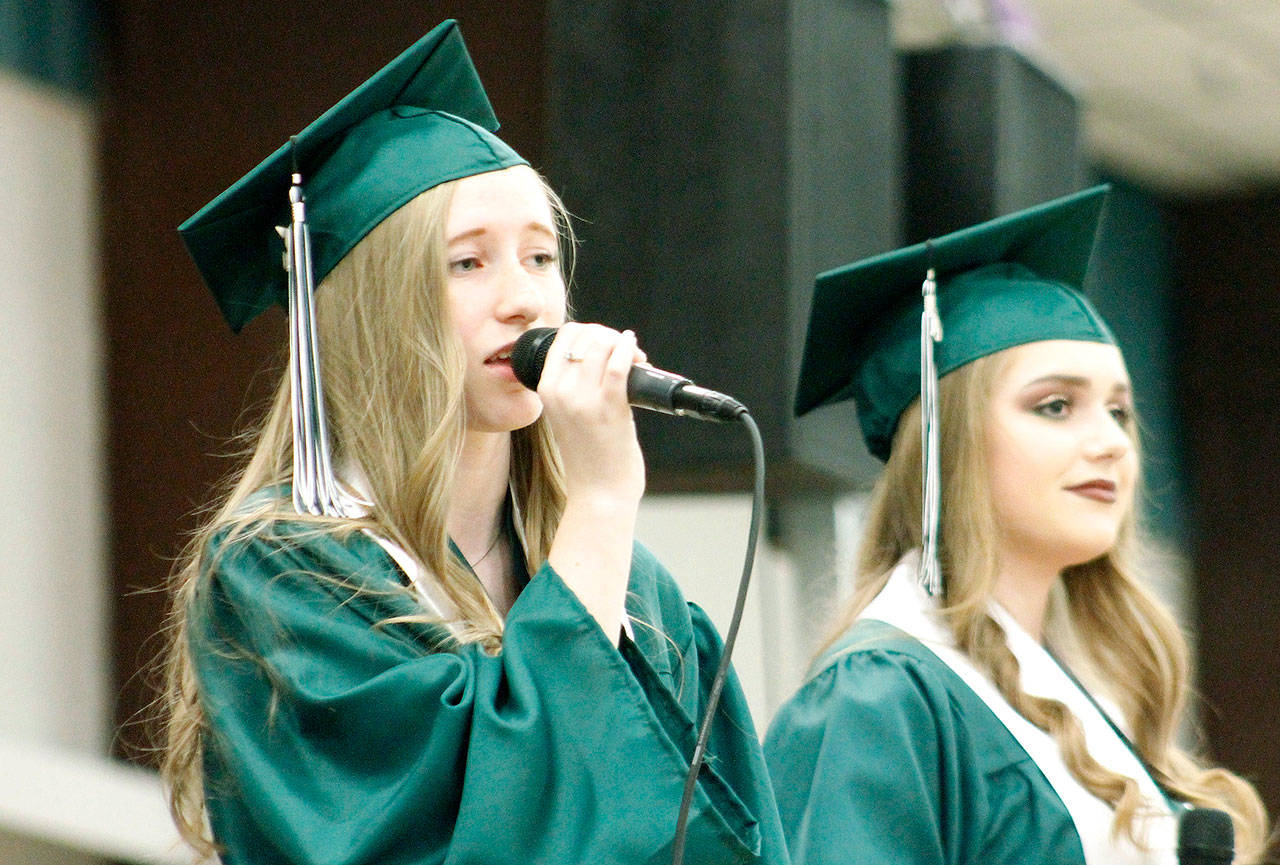 Brooklyn Neshem and Zoe Stevens sing “For Good” from the Broadway musical “Wicked” during the ceremony. (Mark Krulish/Kitsap News Group)