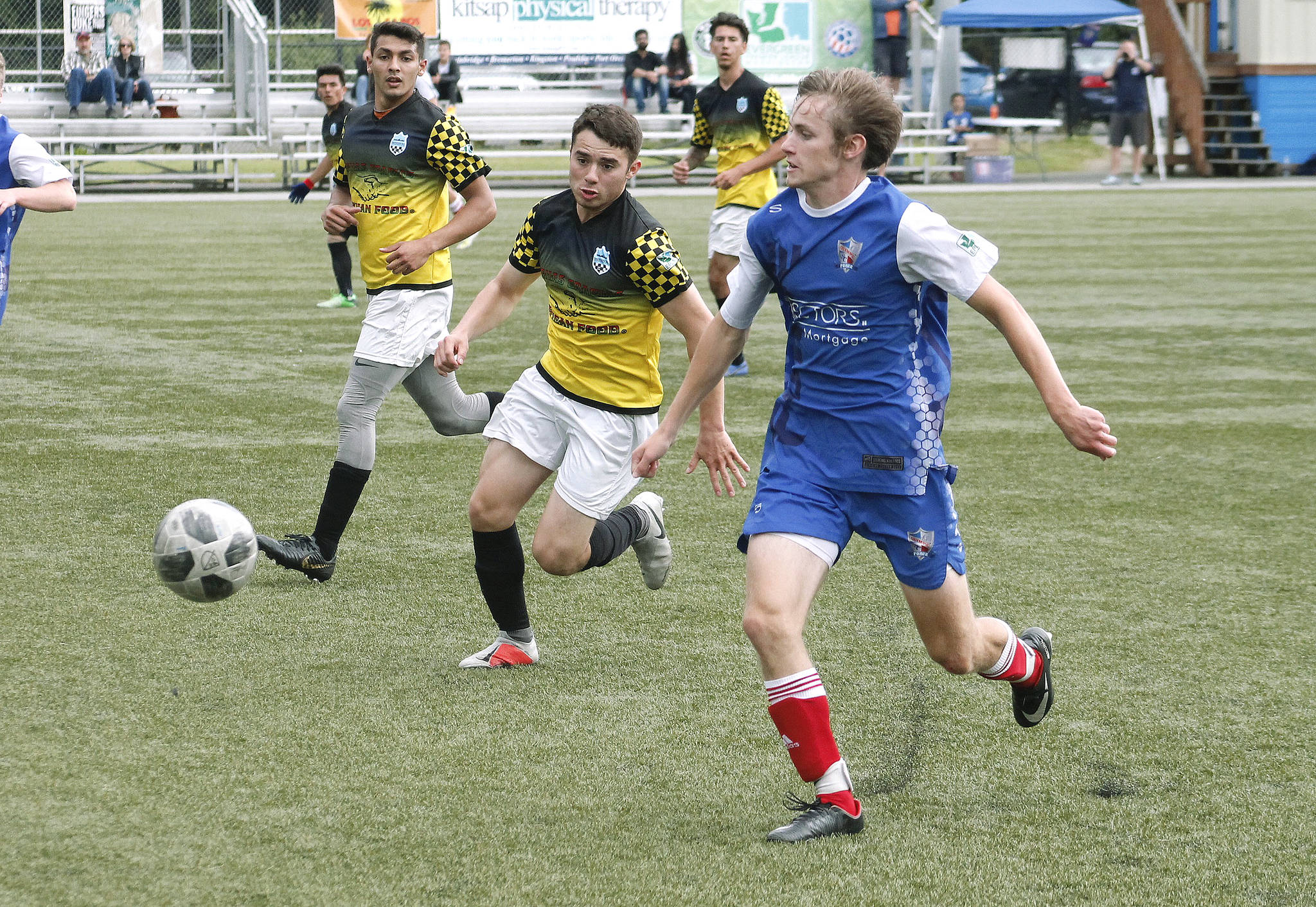 South Kitsap’s Grant Larson, as a member of the Oly-Pen Force, chases down a ball against the Vancouver Victory. (Mark Krulish/Kitsap News Group)