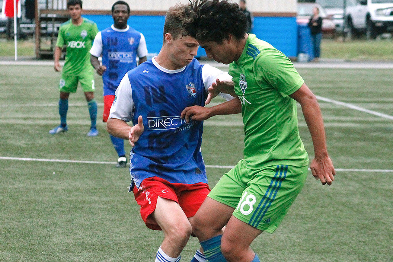 Mitchell Balmer battles for a loose ball against the Seattle Sounders U23 reserves on Tuesday at Gordon Field. (Mark Krulish/Kitsap News Group)