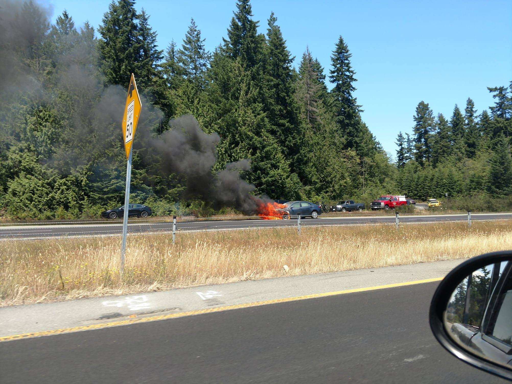 A passerby caught on SR 305 captured this photo of the car as it was engulfed. Photo courtesy of John Kuntz.
