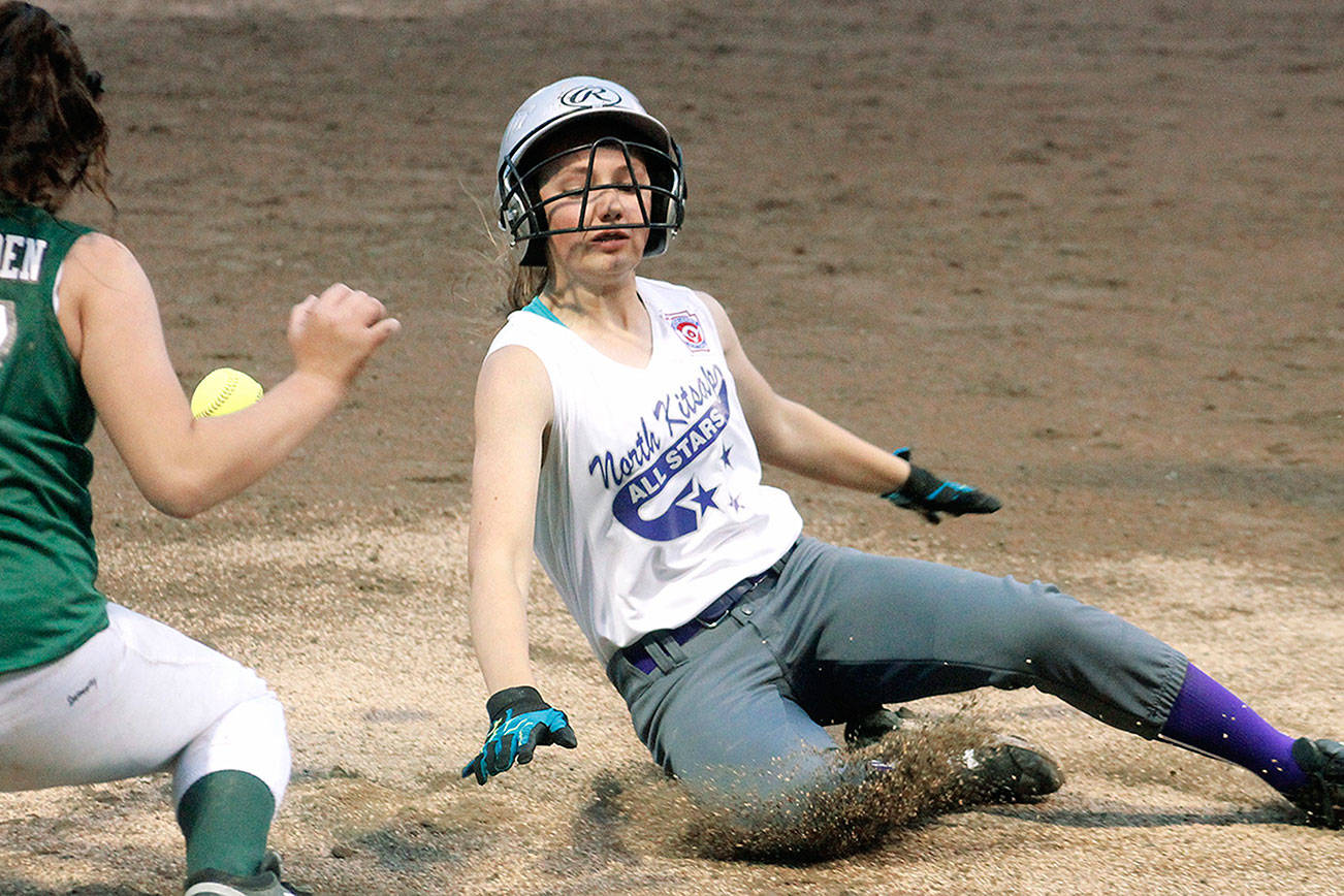 North Kitsap Little League All-Star Kendall Becker slides into third with a triple against Redmond. (Mark Krulish/Kitsap News Group)