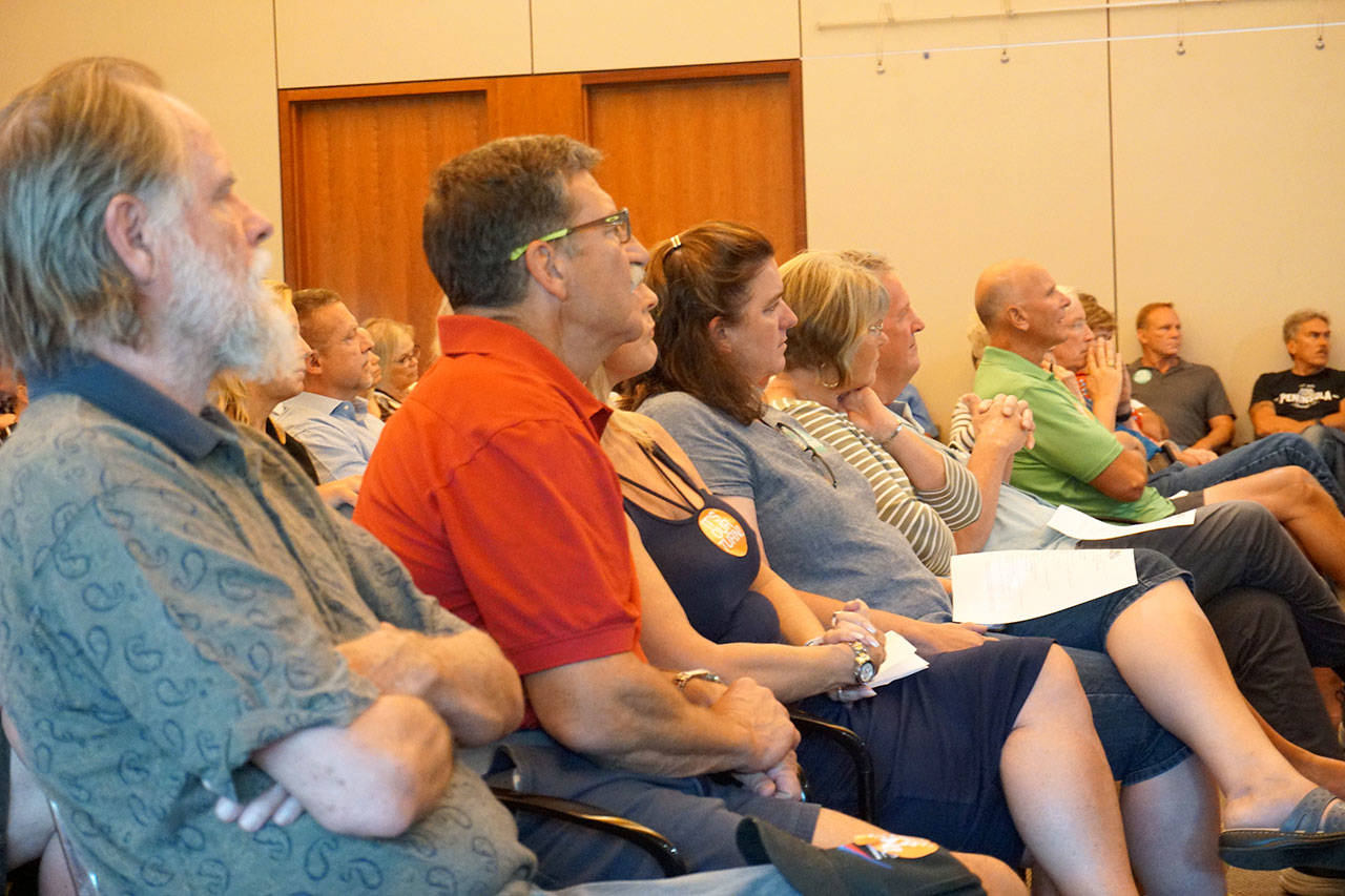 An audience comprising mostly South Kitsap supporters listen as Kitsap Public Facilities District board members discuss their project preferences at their meeting on Monday. (Bob Smith | Kitsap Daily News)