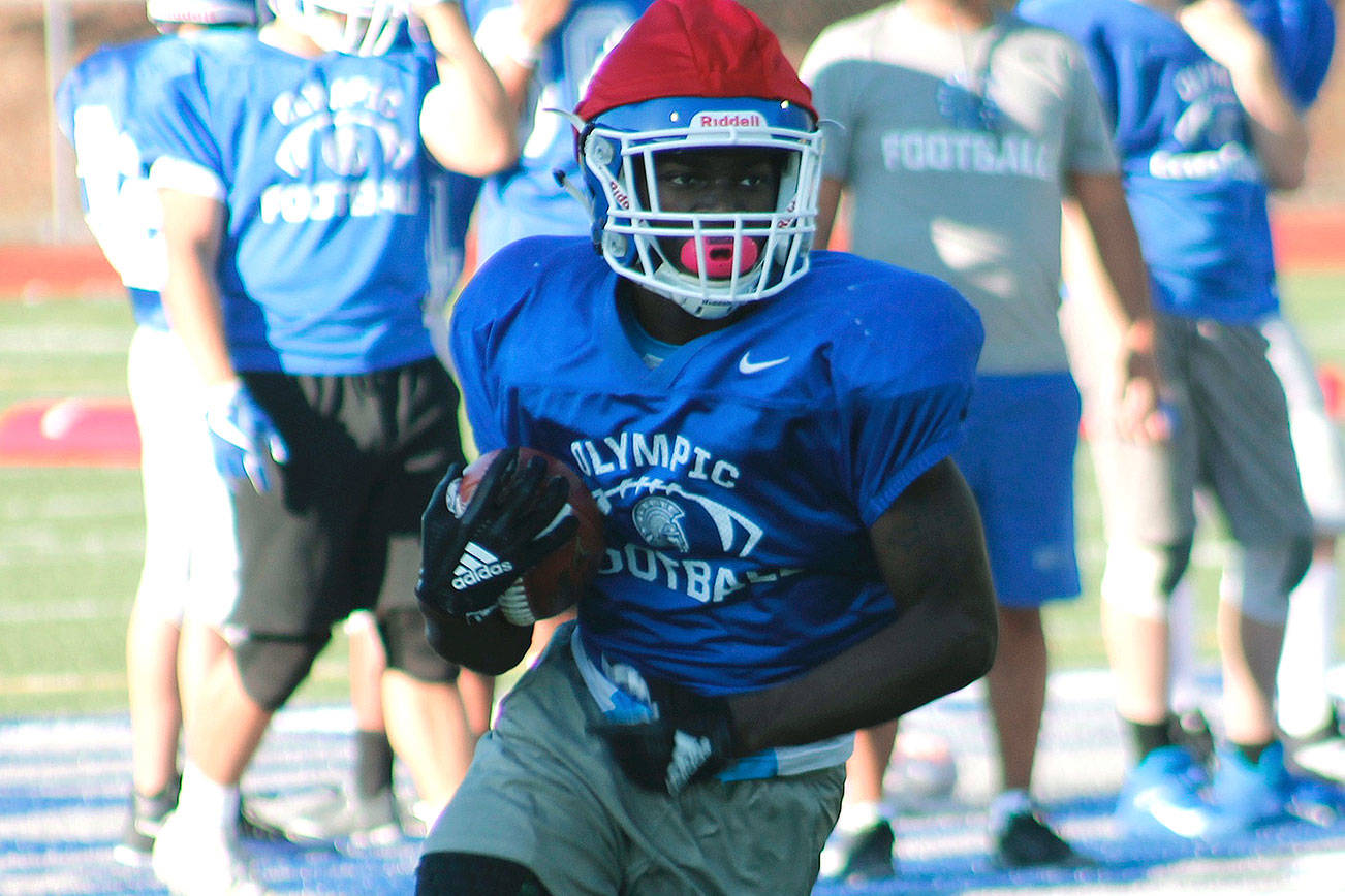 <em>Running back Malcolm Dewalt will help lead an explosive Olympic offense this season. </em>                                Mark Krulish/Kitsap News Group