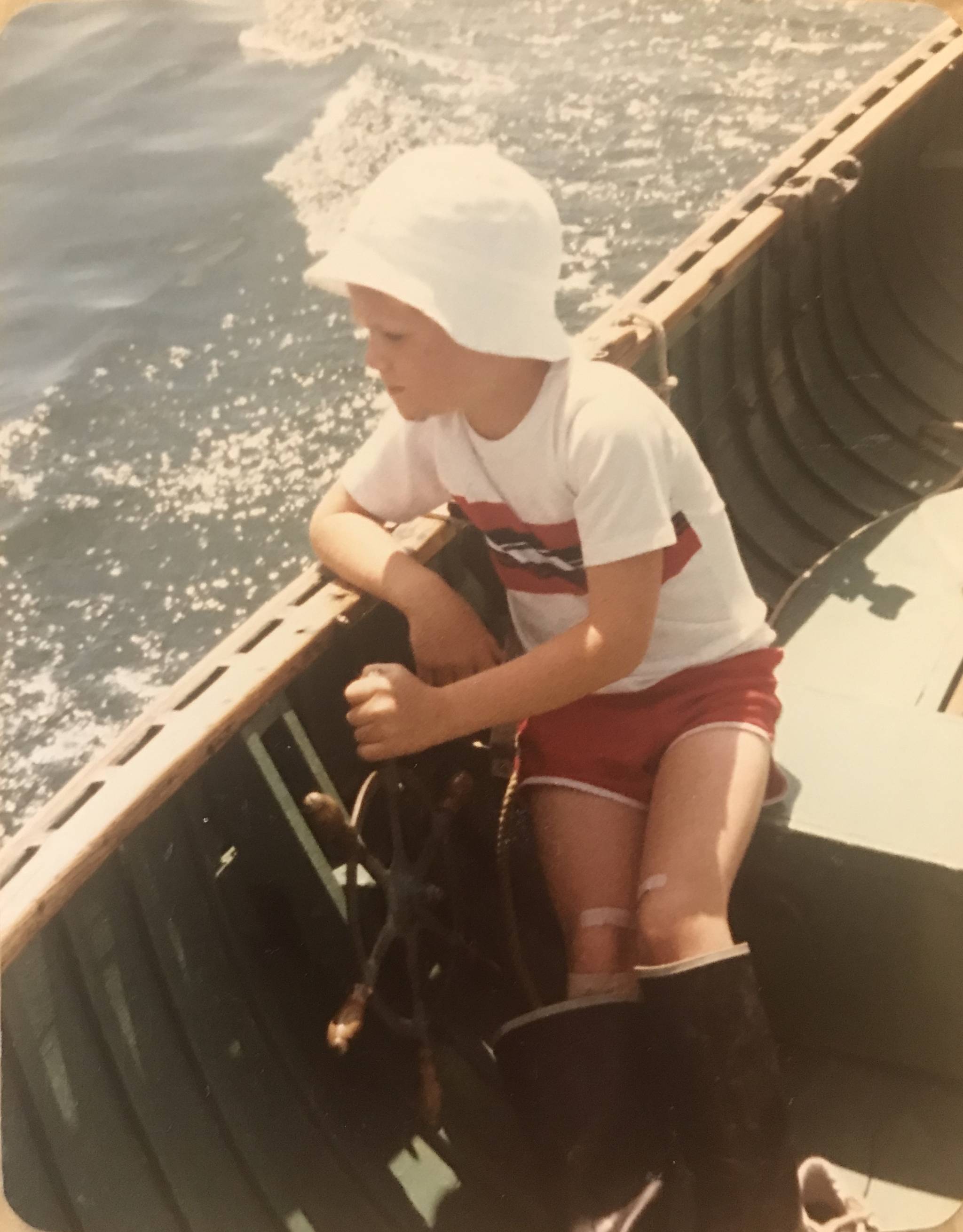 Matt Diehl helms his grandfather’s Poulsbo Boat in 1982, at the age of 8. Photo courtesy Matt Diehl.