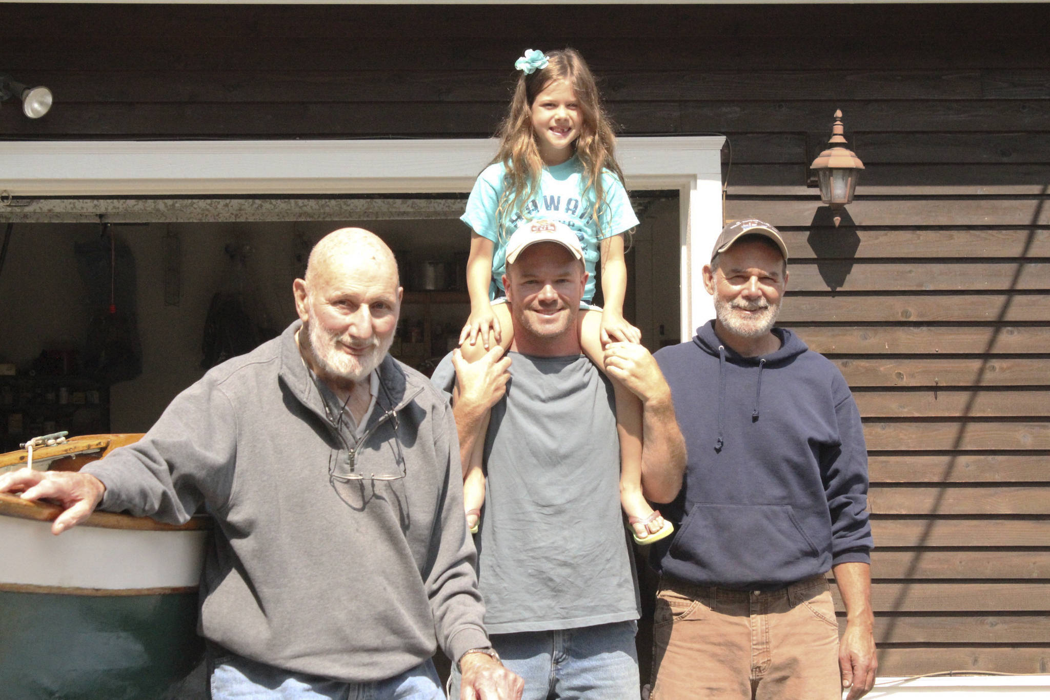 <em>Paul Diehl, Matt and Shelby Diehl and Eric Diehl stand beside their Poulsbo Boat. </em>Nick Twietmeyer/ Kitsap News Group