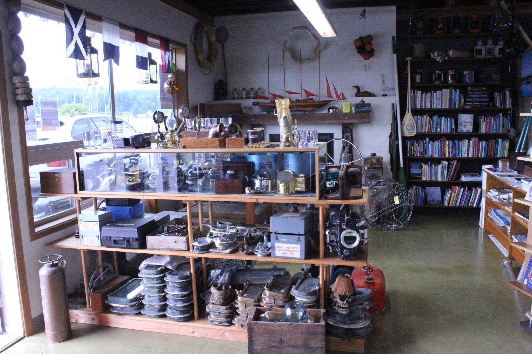 <em>Plenty of books and various nautical gear, parts and accessories line the walls of Longship Marine’s new shop.</em>                                Nick Twietmeyer/Kitsap News Group