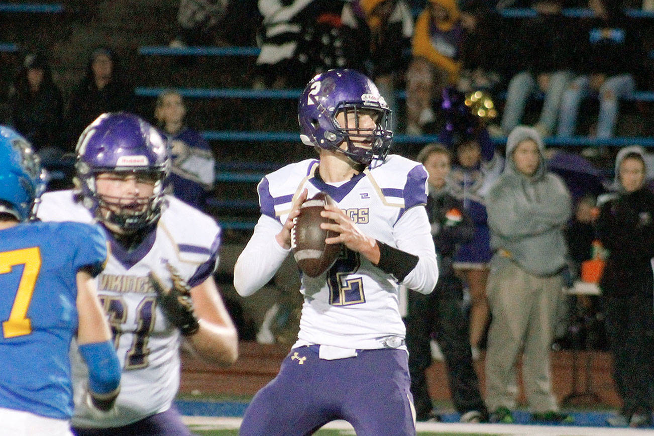 North Kitsap quarterback Colton Bower threw three touchdowns and rushed for two more against Bremerton. (Mark Krulish/Kitsap News Group)
