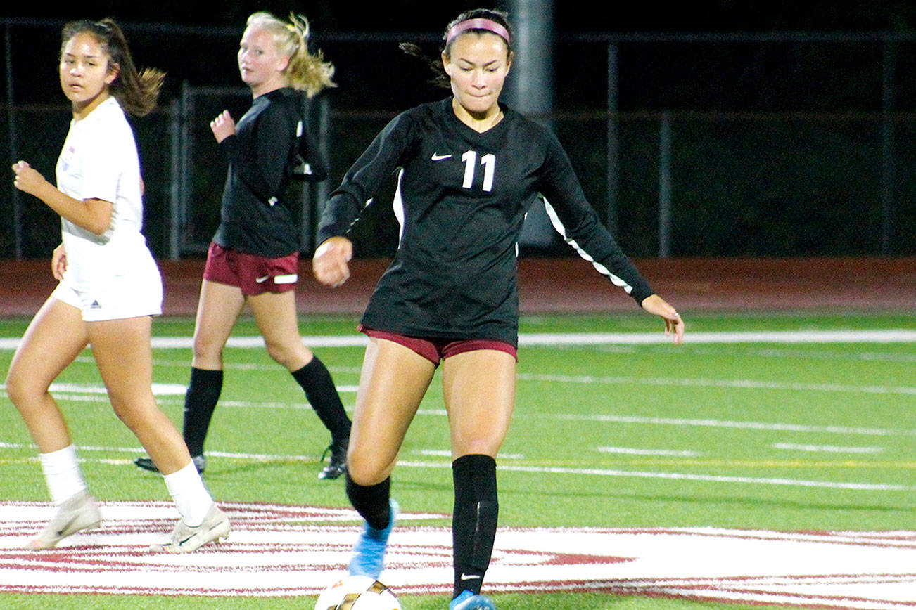 South Kitsap’s Franqie Moppins sends a pass towards her winger against Graham-Kapowsin. (Mark Krulish/Kitsap News Group)