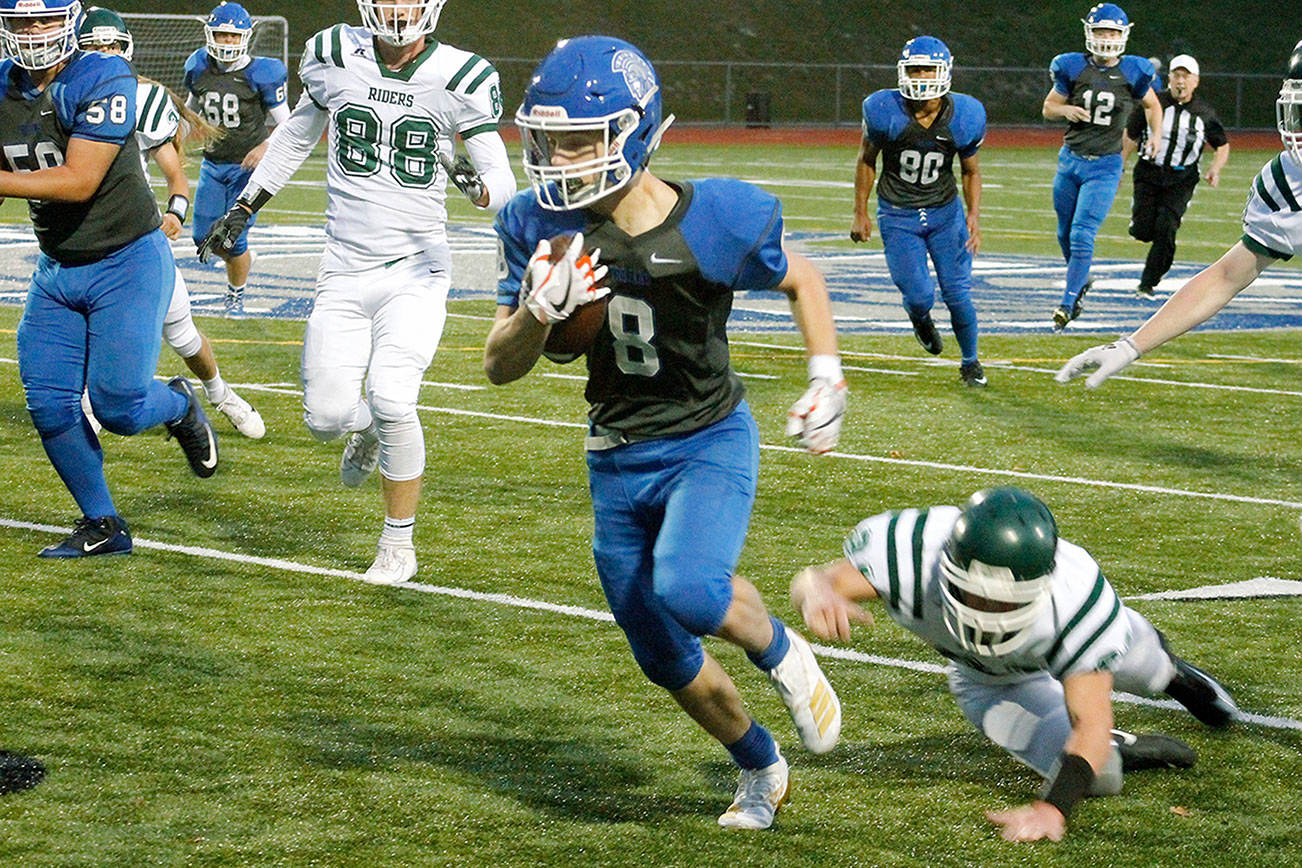 Trent Feistner had a big night for Olympic, rushing for 320 yards and two touchdowns in a win over Port Angeles. (Mark Krulish/Kitsap News Group)