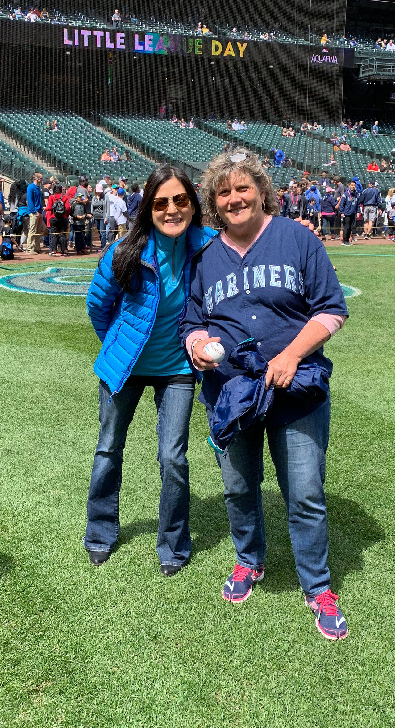 (l-r) Dr. Ani Fleisig and Diane Munroe at T-Mobile Park, where Diane got to throw out the first pitch at the Mariners game. (photo courtesy of Diane Munroe)