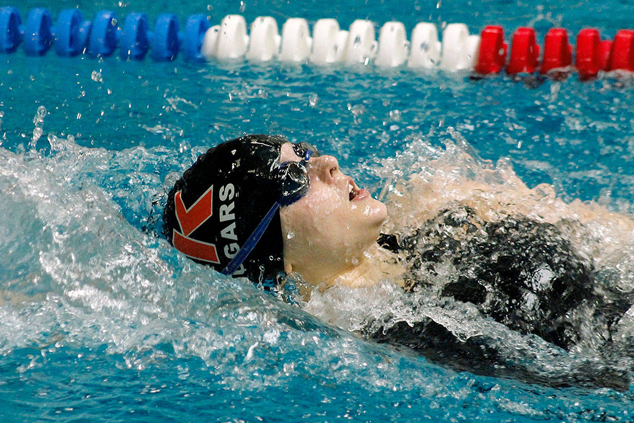 Central Kitsap’s Amanda Ashmore swims to victory in the 100 yard backstroke at the Olympic Swimvitational. Ashmore also won Swimmer of the Meet. (Mark Krulish/Kitsap News Group)