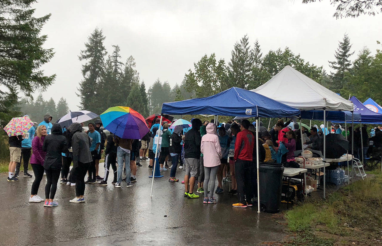 Nearly 180 people ran in the pouring rain in support of the 5K Run for cystic fibrosis, organized by South Kitsap High students Piper Willson and Joseph Laws. (Courtesy photo)