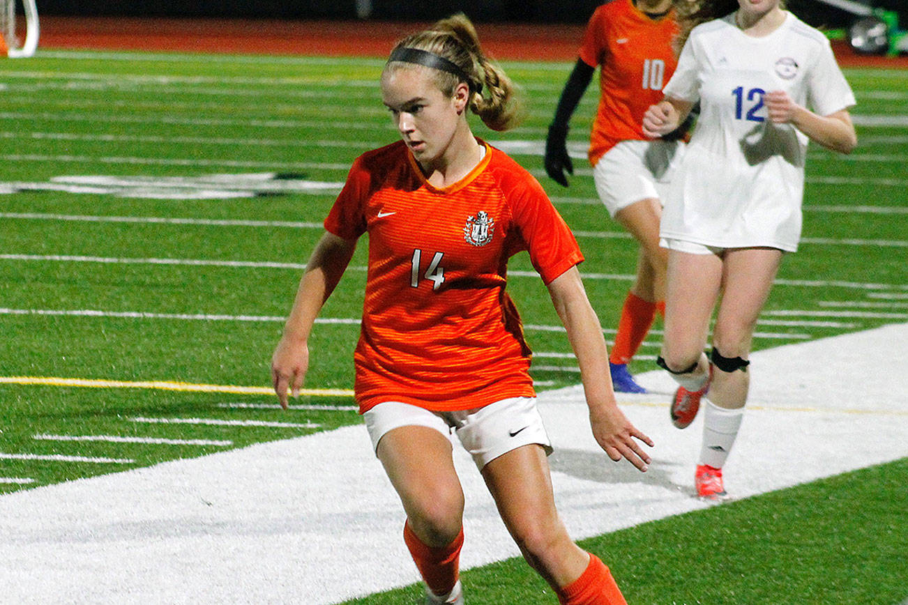 Central Kitsap freshman Ella Smith looks to move the ball upfield against Kelso in her team’s 1-0 playoff victory. (Mark Krulish/Kitsap News Group)