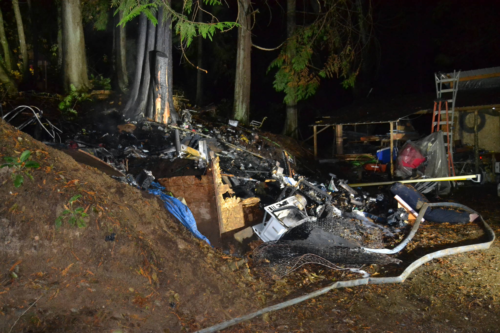 Woodstove ashes spark Monday night blaze