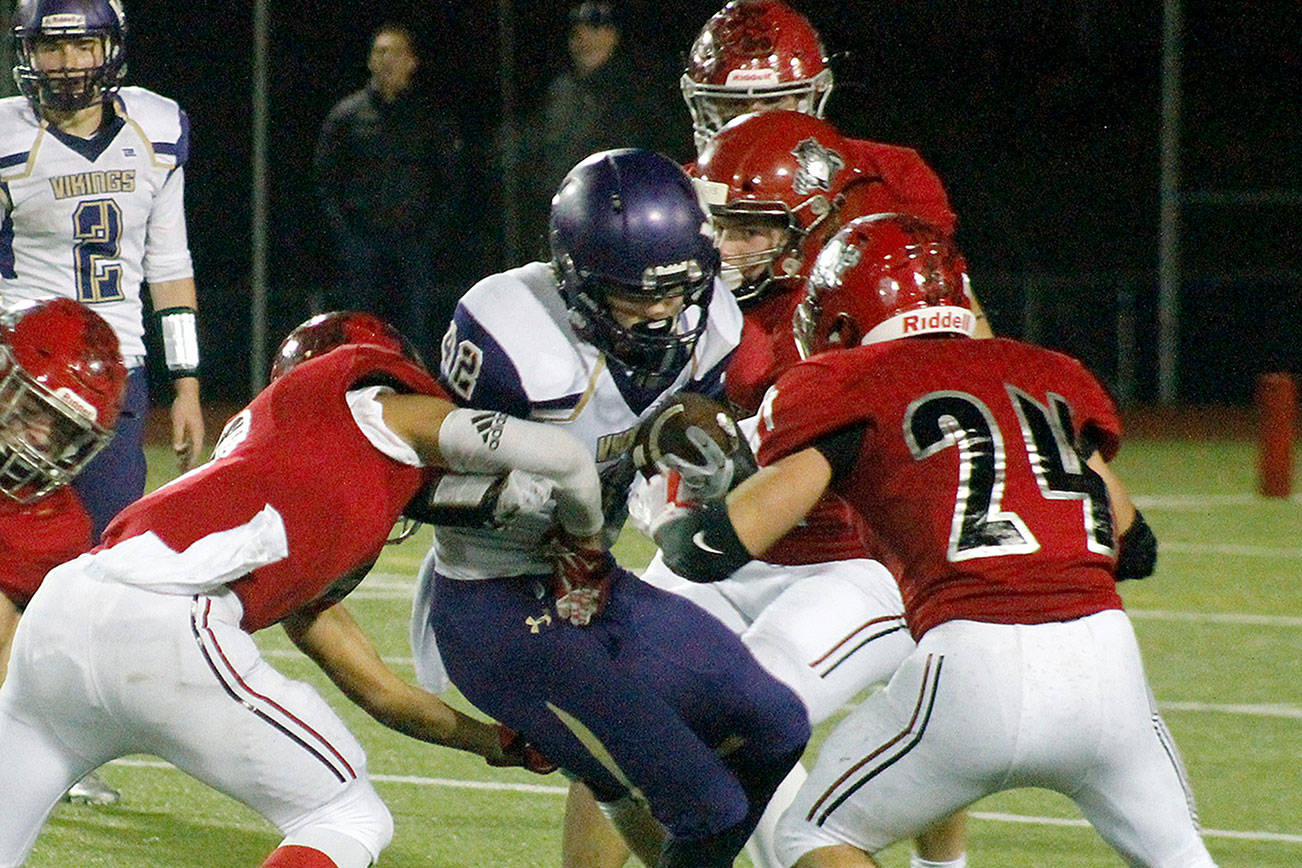 North Kitsap running back Taylor Jackson tries to maneuver through the Archbishop Murphy defense. The Wildcats won 46-0. (Mark Krulish/Kitsap News Group)