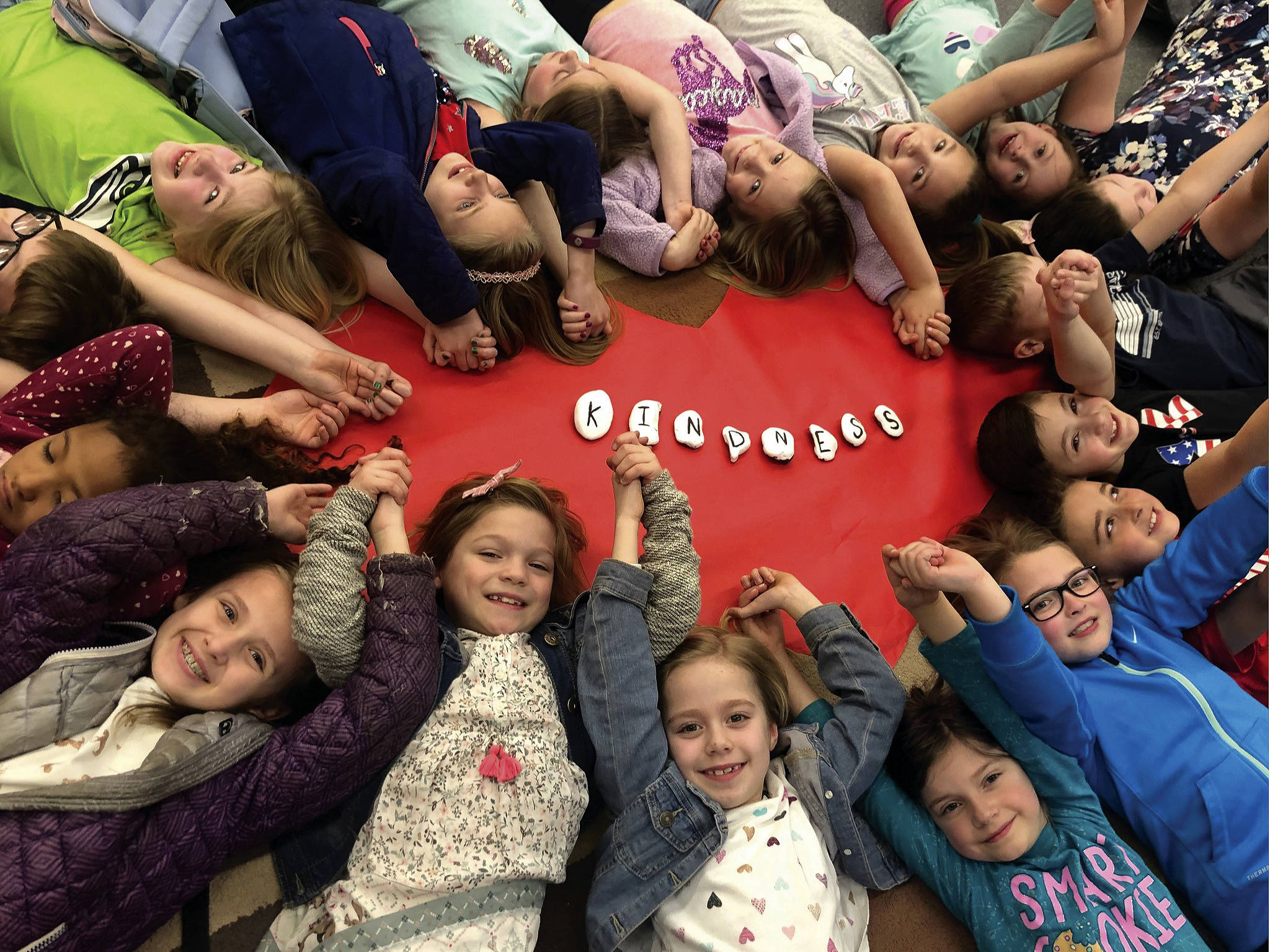 Photo courtesy of Patty Pace                                These students from Patty Pace’s second-grade class last year at South Colby Elementary gathered in a circle to exhibit the true meaning of kindness and how it spreads in an interconnected way.