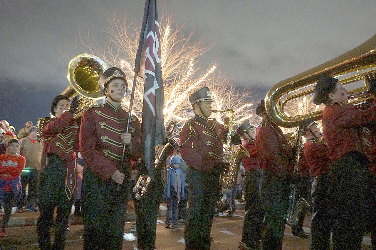 South Kitsap High’s marching band strikes up some holiday music as it marches on Bay Street. (Bob Smith | Kitsap Daily News 2018)