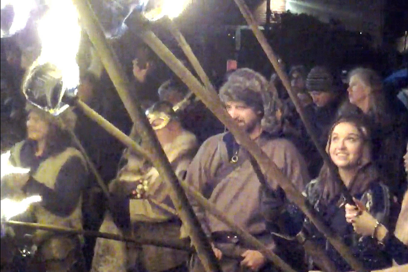 Vikings await the Lucia Bride’s lighting of the Julefest bonfire at Muriel Iverson Williams Waterfront Park. File photo