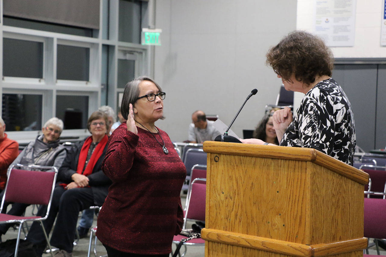 Cindy Webster Martinson was sworn in as a member of the North Kitsap School District by Poulsbo Mayor Becky Erickson on Dec. 12, 2019.