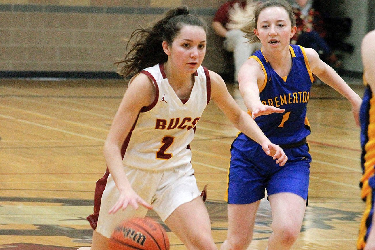 Point guard Kylee Walker bursts through the Bremerton defense. Walker finished her team’s 70-14 win with 15 points. (Mark Krulish/Kitsap News Group)