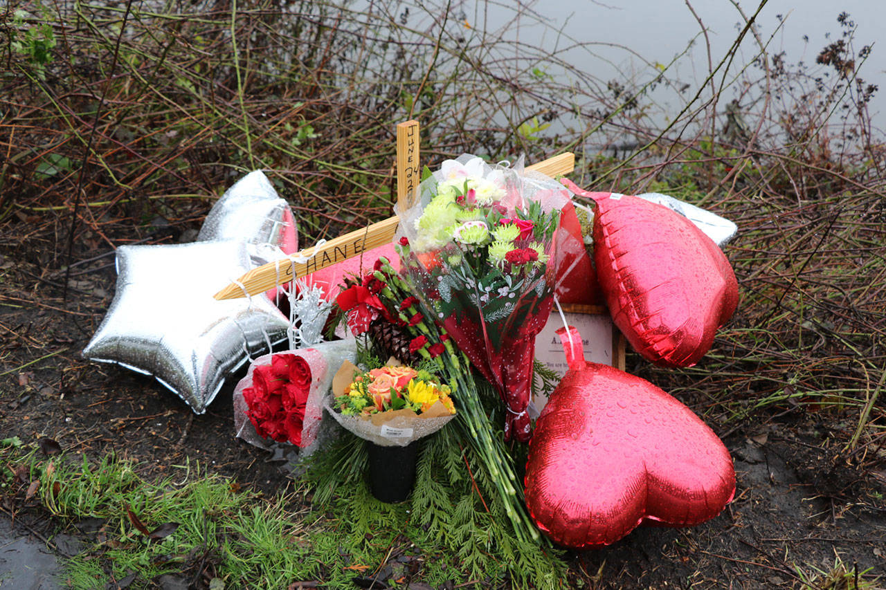 A small memorial for Shane Larson began to grow as family and friends brought flowers and candles to the site where Shane died on Fjord Drive.