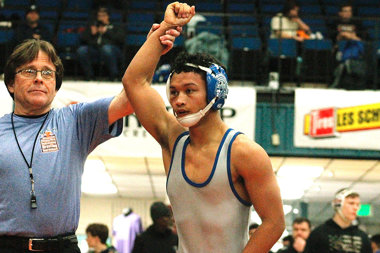 Olympic’s Anjelo Pangelinan took home a championship at 113 after pinning his first three opponents and then winning a major decision in the finals. (Mark Krulish/Kitsap News Group)