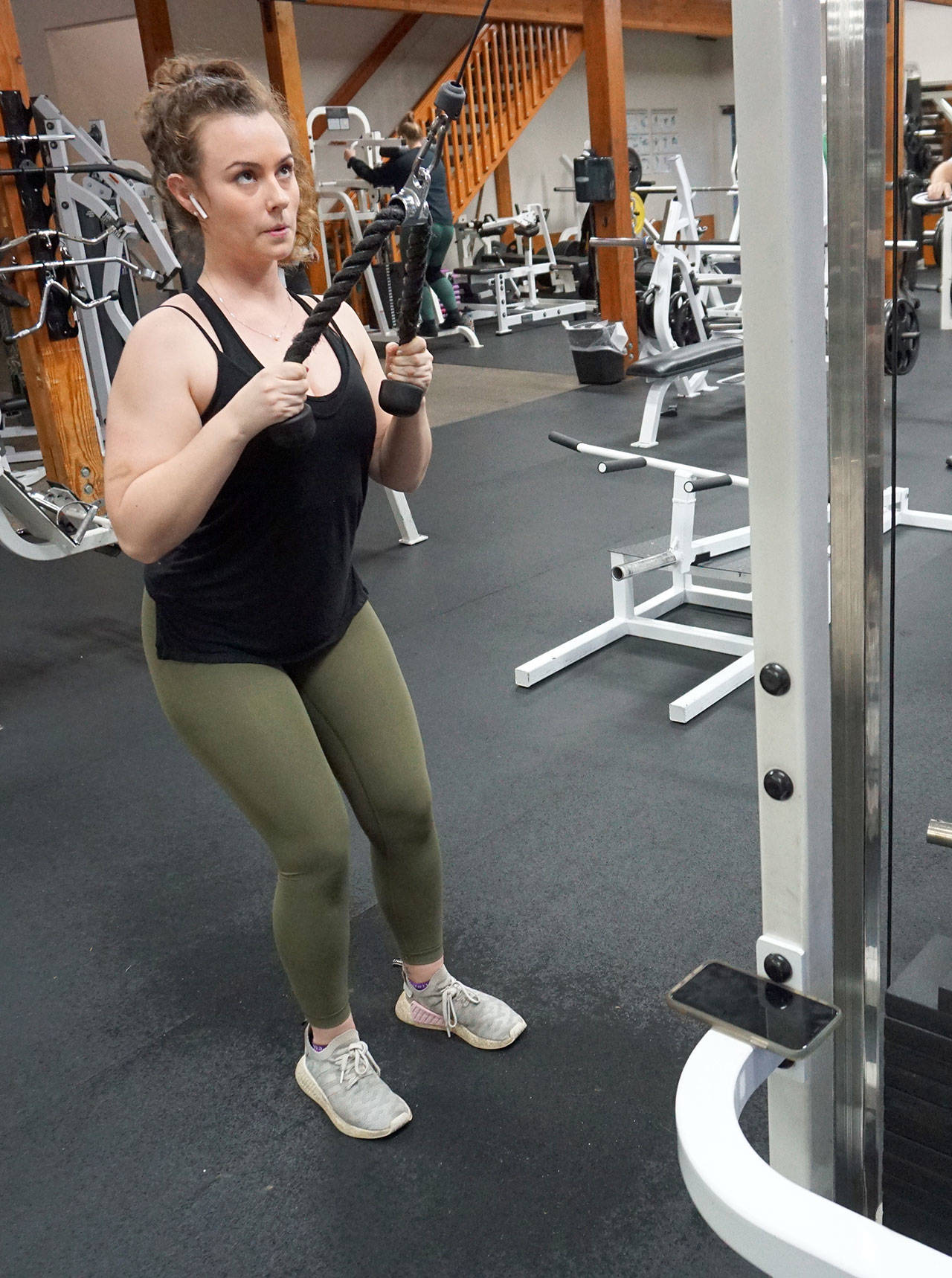 Katie Royster of Port Orchard works her upper body in the Westcoast Fitness center.