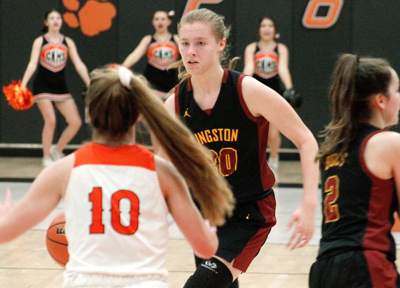 Kingston’s Ellee Brockman looks to drive the lane against Central Kitsap’s Maddy Anderson. Brockman had a game-high 17 points for the Bucs in their win. (Mark Krulish/Kitsap News Group)