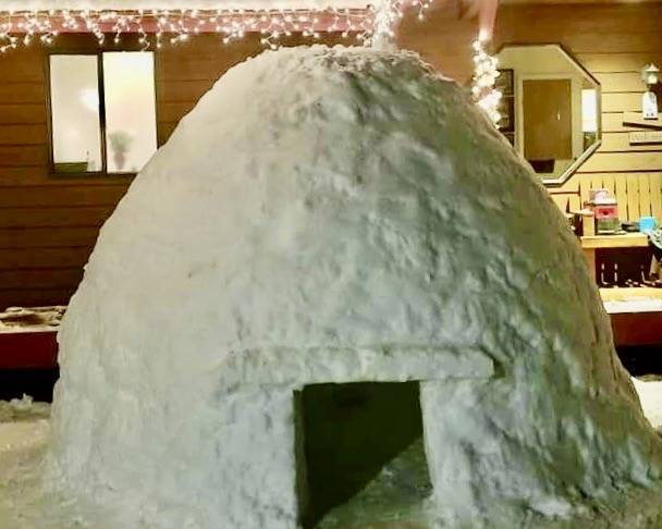 After hours of building, Peterson’s igloo is finally complete. (photo by Stella Peterson)