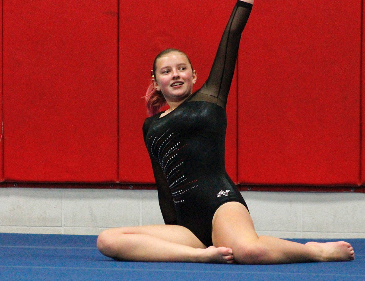 Kingston gymnast Peri Anderson finishes her floor routine. (Mark Krulish/Kitsap News Group)