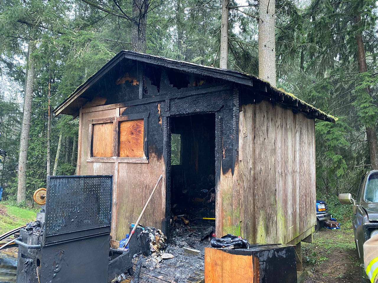 <em>NKF&R crews quickly extinguished a fire, thought to have been sparked by a cellphone charging cord, in a sleeping cabin near Kingston on Wednesday morning but were unable to save two pet reptiles trapped inside.</em>Photo courtesy of NKF&R