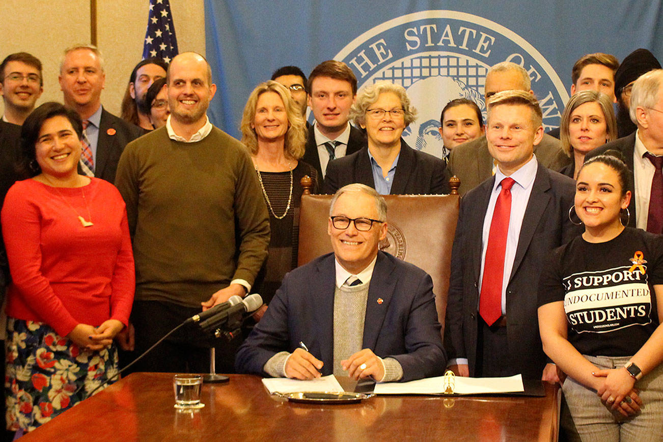 Inslee signs tax bill to help fund higher education