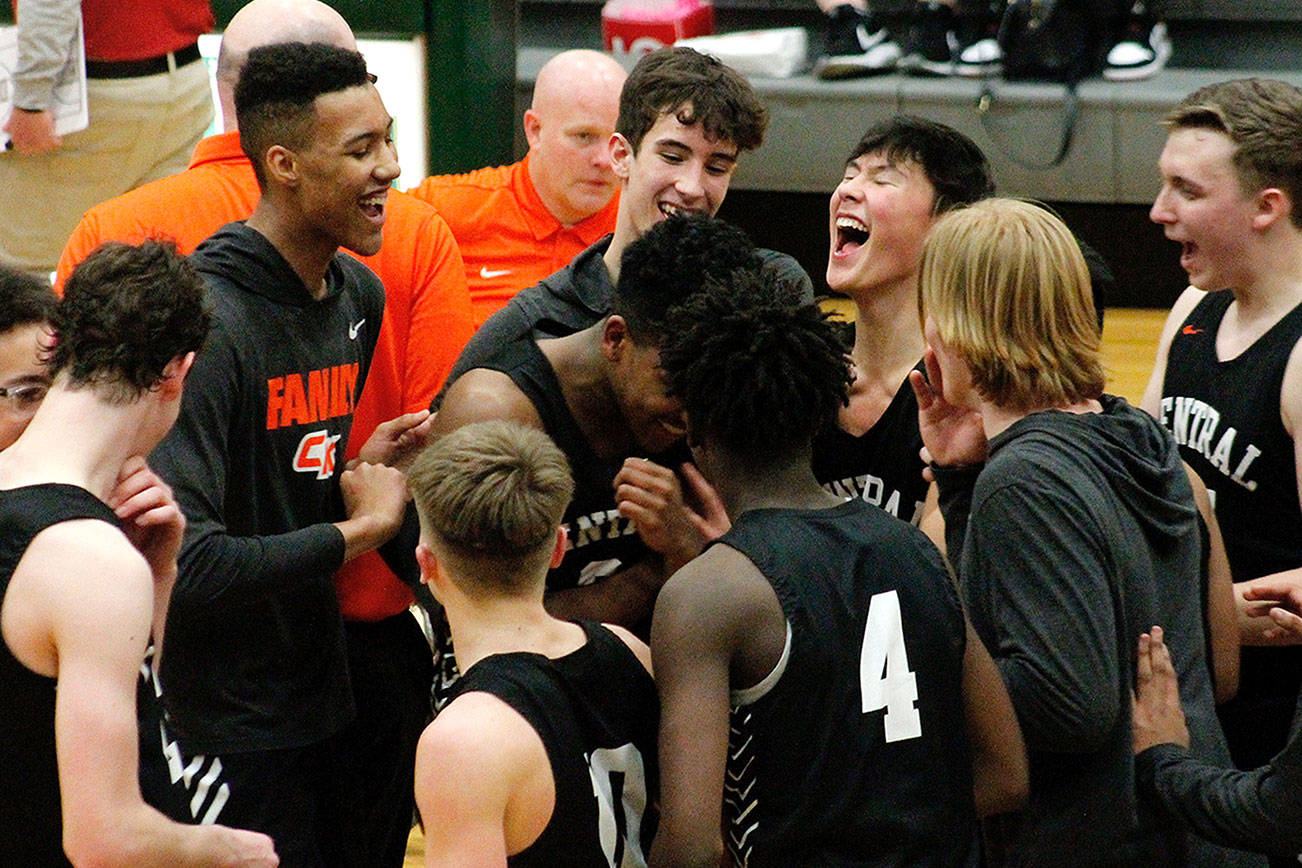 Central Kitsap celebrates its 41-39 victory over Capital and its first state berth since 2004. (Mark Krulish/Kitsap News Group)