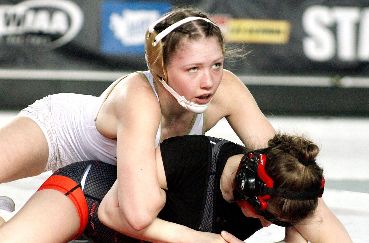 Holly Beaudoin grapples with Maizy Feltwell of Liberty in the finals at this year’s state wrestling meet. (Mark Krulish/Kitsap News Group)