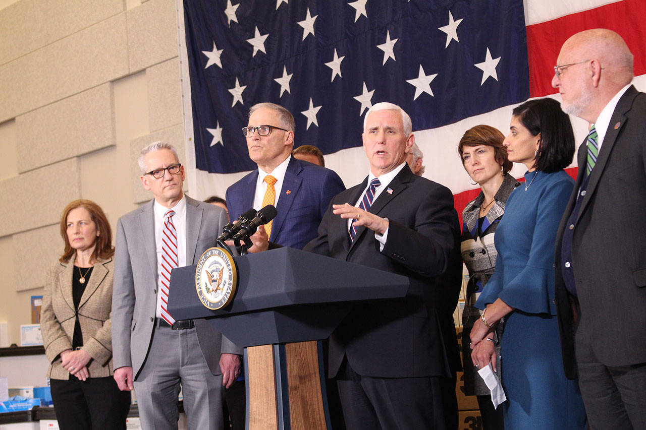 Vice President Mike Pence, center and Washington Gov. Jay Inslee, to his left with state and federal officials addressed discussed a cooperative response to the COVID-19 coronavirus. (Cameron Sheppard | WNPA News Service)