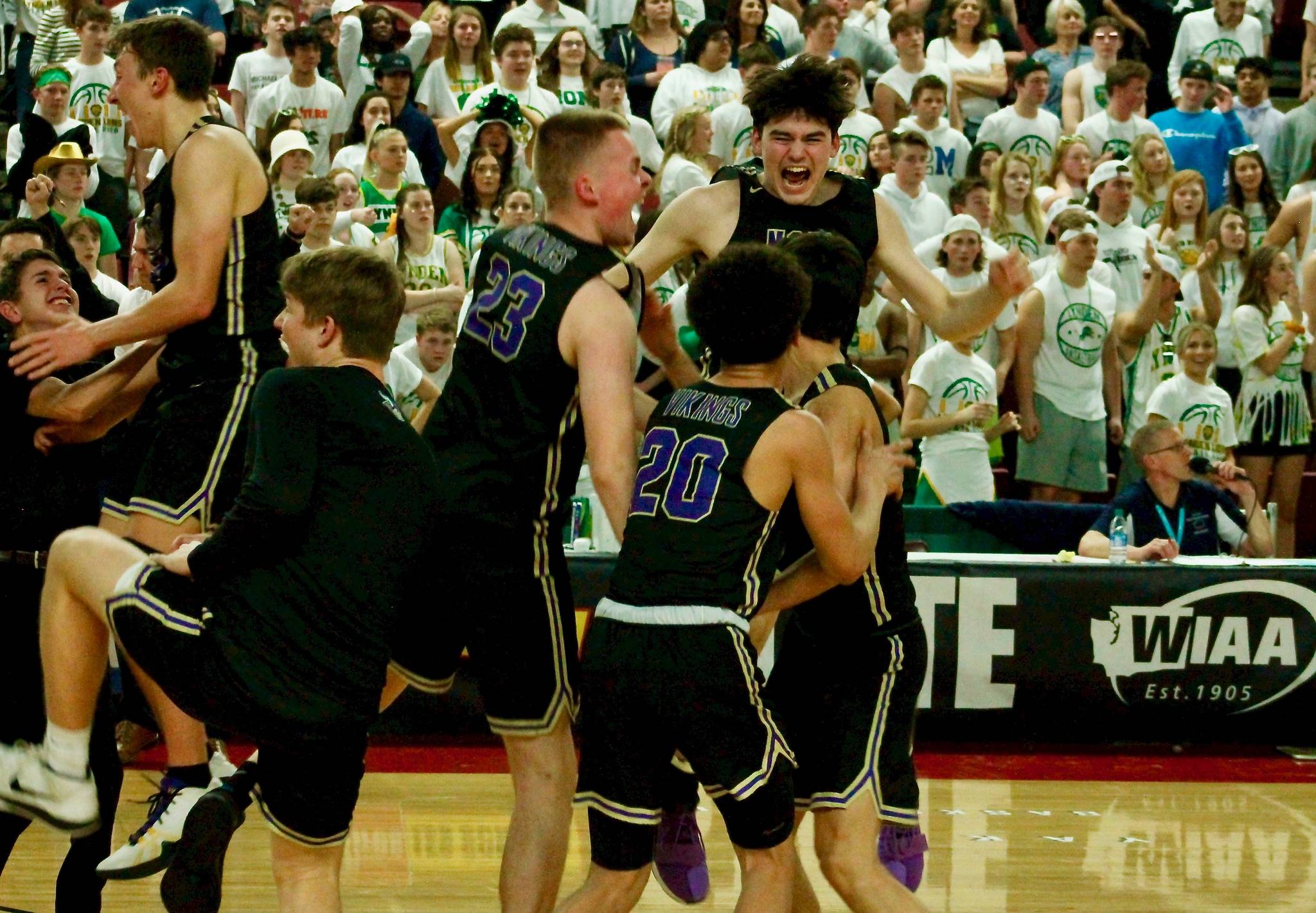 North Kitsap celebrates their stunning semifinal victory over Lynden moments after the buzzer sounds. (Mark Krulish/Kitsap News Group)