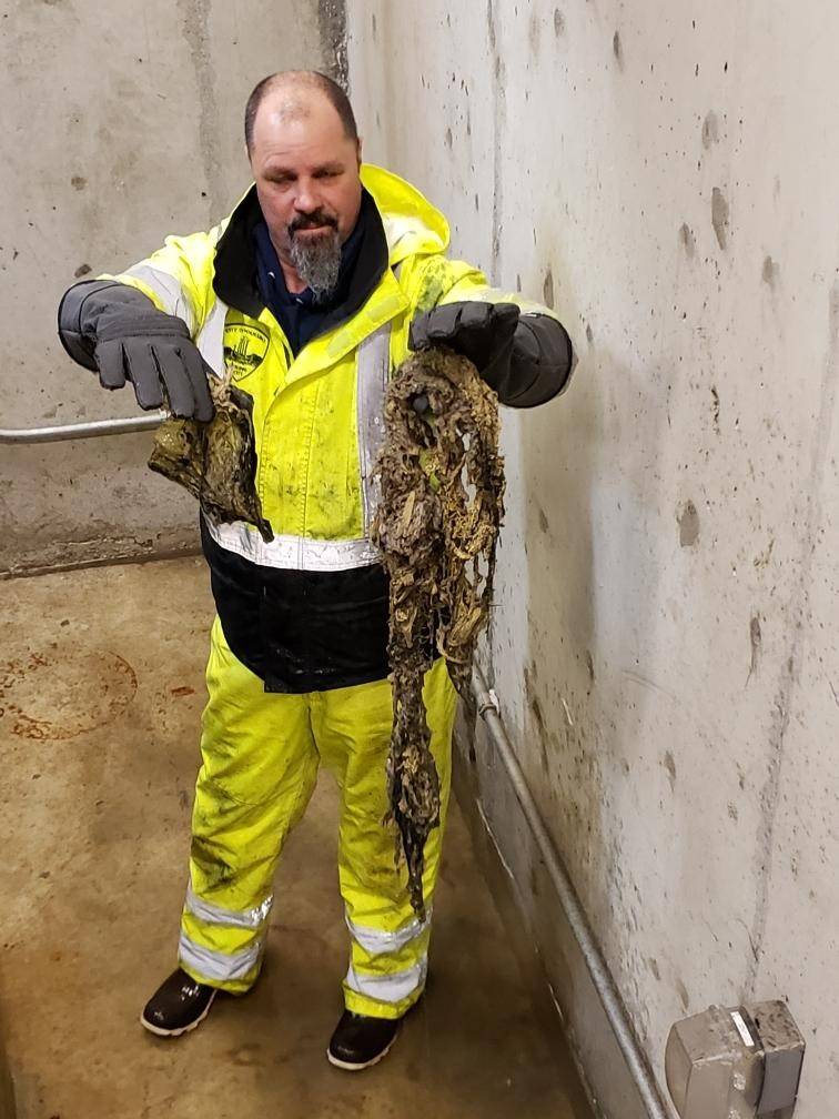 City Public Works employee Tom Barnes holds up a clog caused by “flushable” wipes from one of Poulsbo’s nine lift stations. (Photo courtesy of Mike Lund)