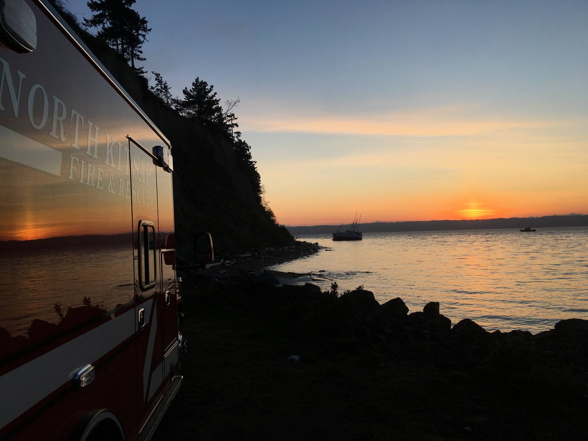 North Kitsap Fire & Rescue crews had to respond to President Point at 5:17 a.m. to rescue three adults in a vessel that had run aground. (Photo courtesy North Kitsap Fire & Rescue)