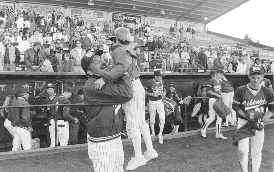 Virgil Taylor celebrates with his son, David, who served as the bat boy for North Kitsap’s 1988 state championship team. (Contributed photo by the Taylor Family)